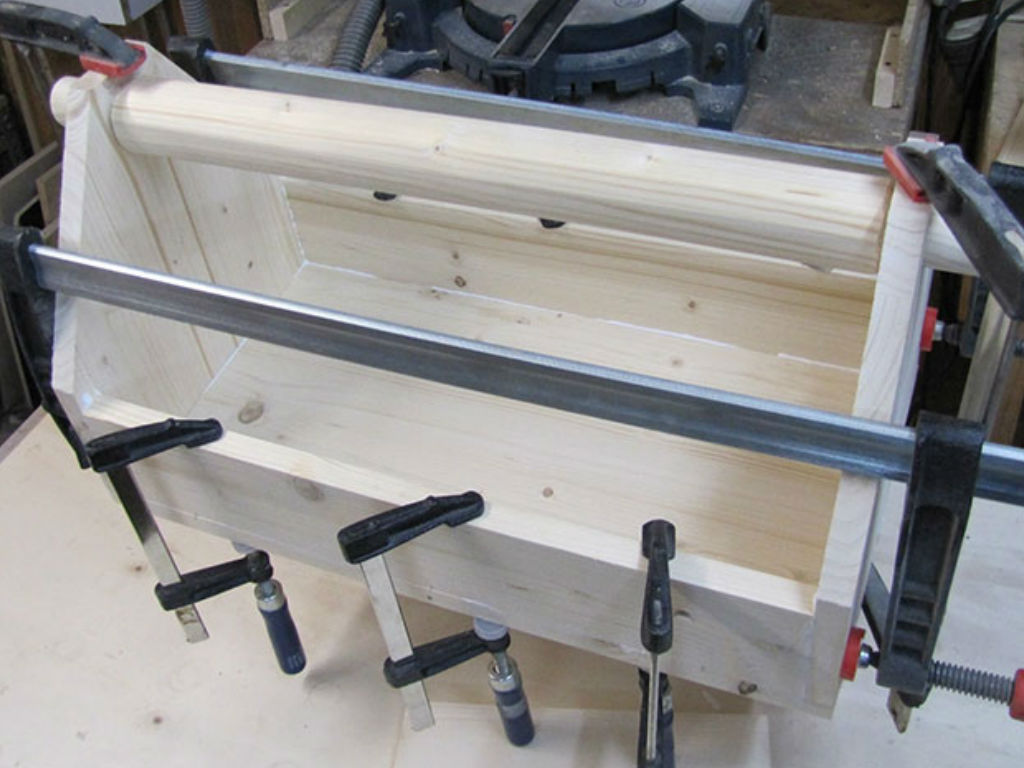 clamping together the wooden tool box