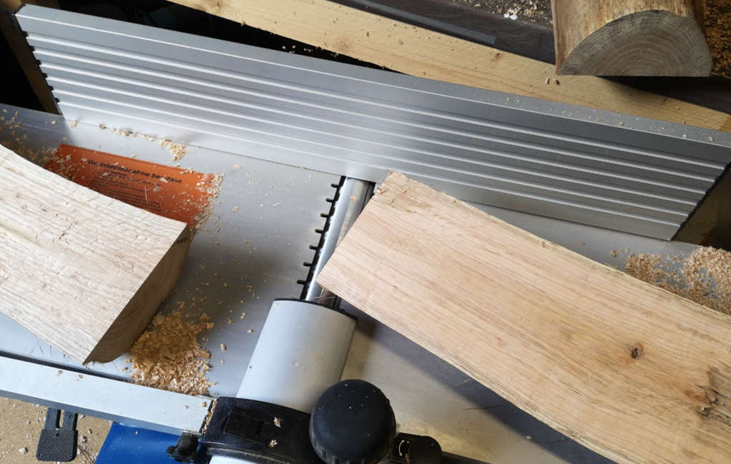Sanding wooden boards to smooth the surface for a DIY decoration