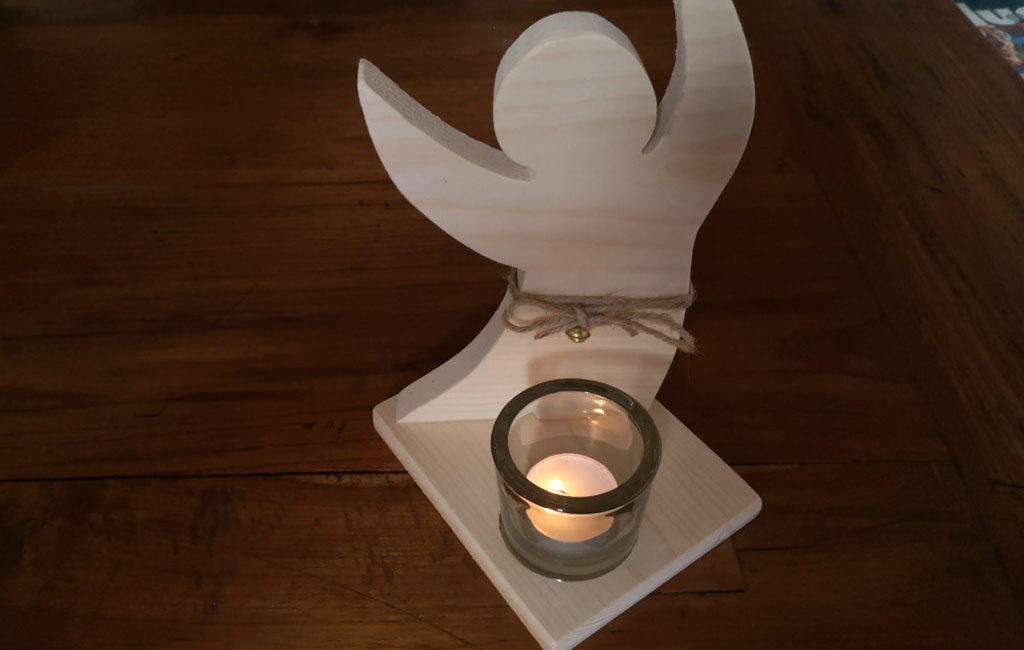 Wooden angel decoration with a tealight candle holder