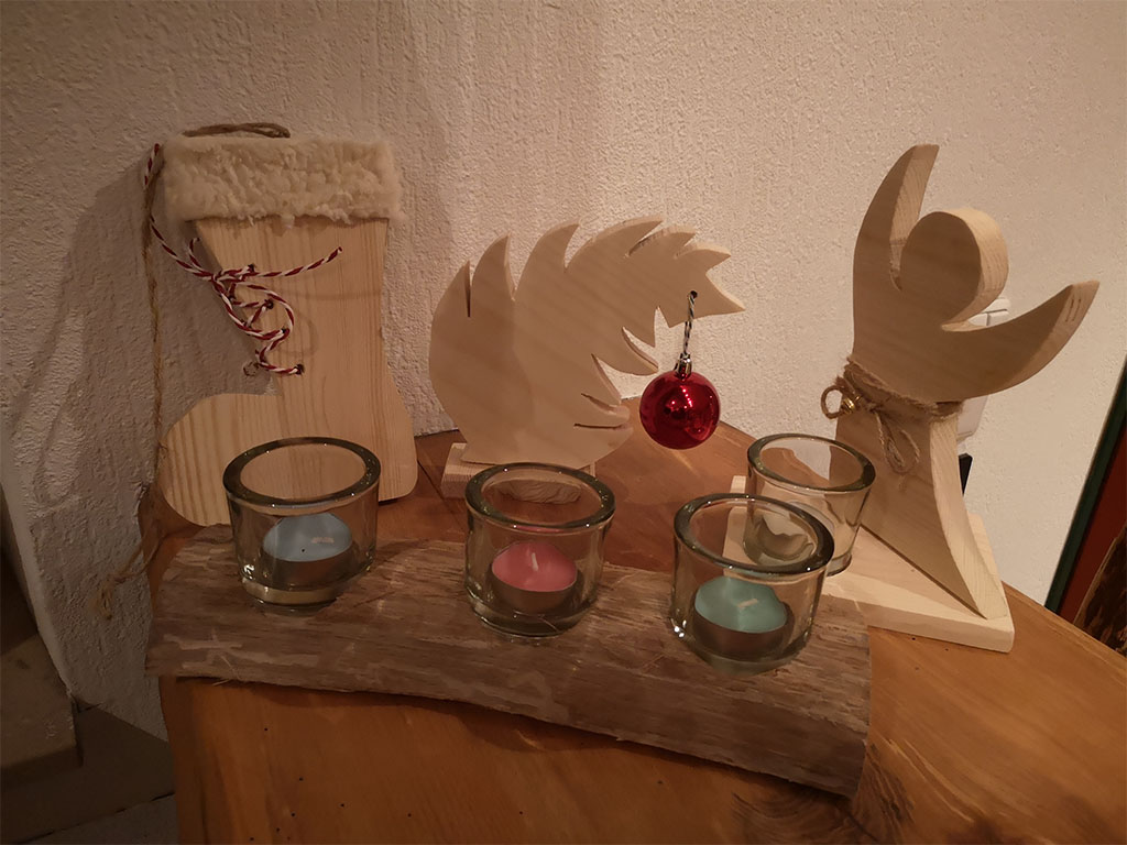 DIY wooden Christmas decoration with candles and ornaments