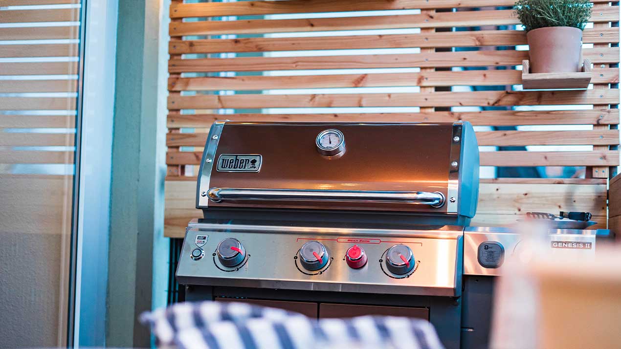 A Weber barbecue on a terrace.