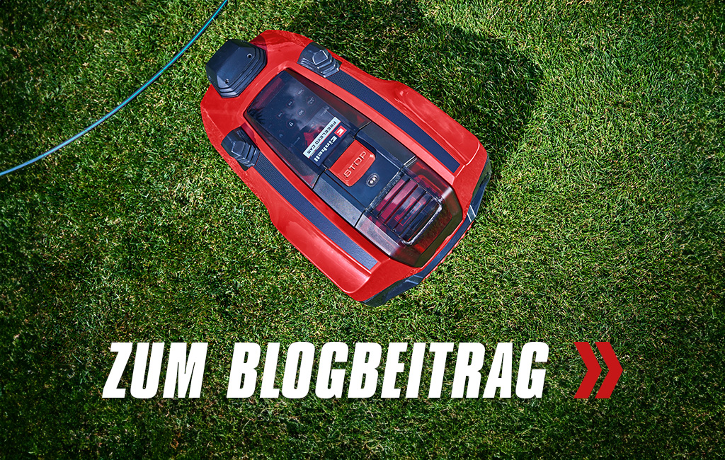 Nahaufnahme eines Rasenmähroboters von Einhell. Text im Vordergrund: Zum Blogbeitrag