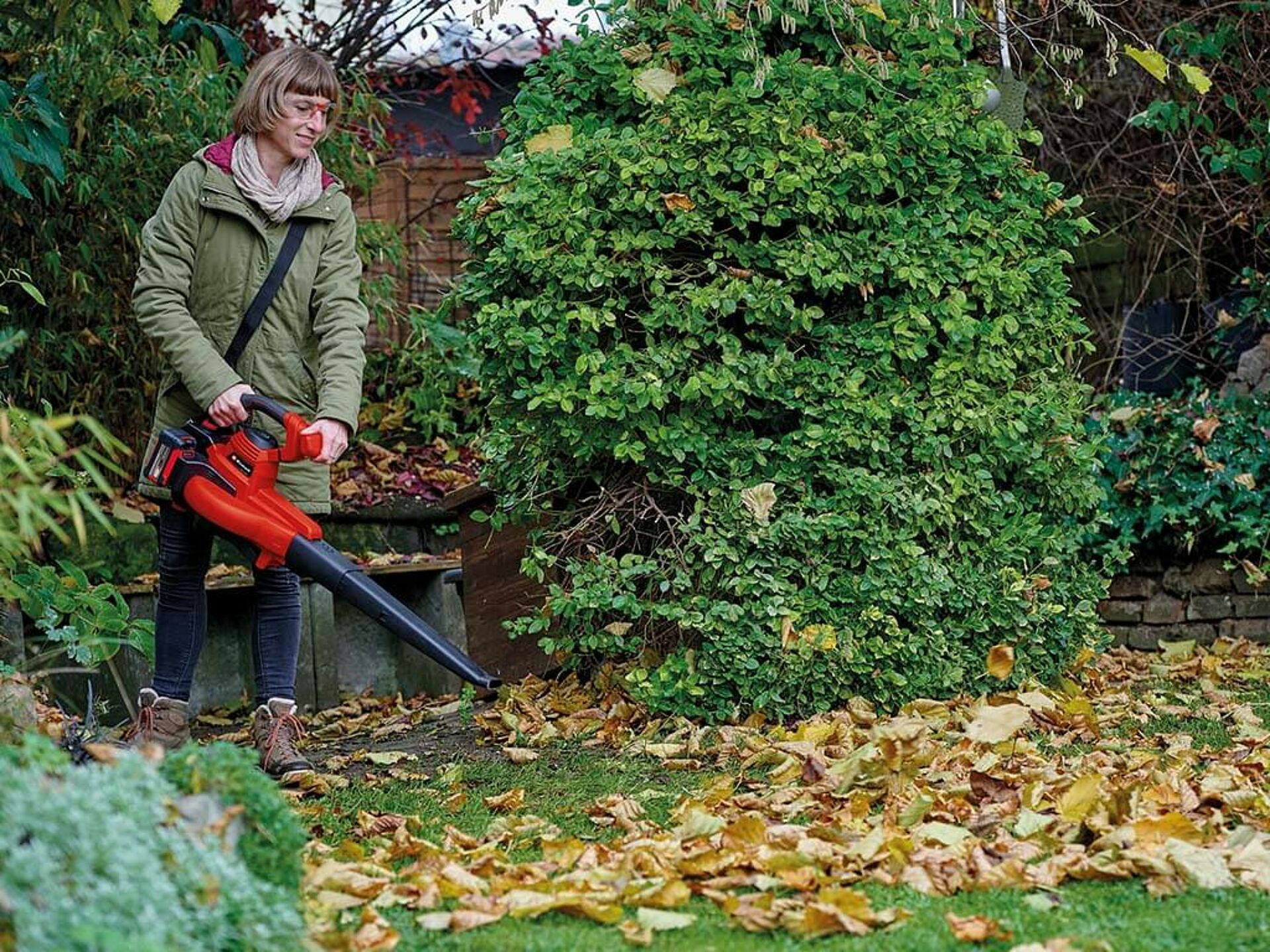 Leaves are blown away with an Einhell leaf blower.