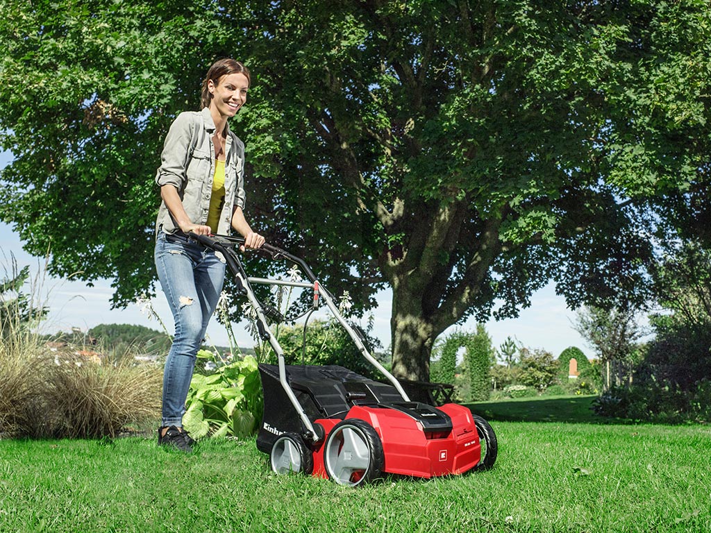 a woman scarifies her garden