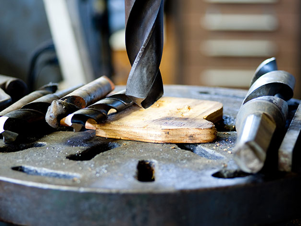 A hole is drilled into a piece of wood