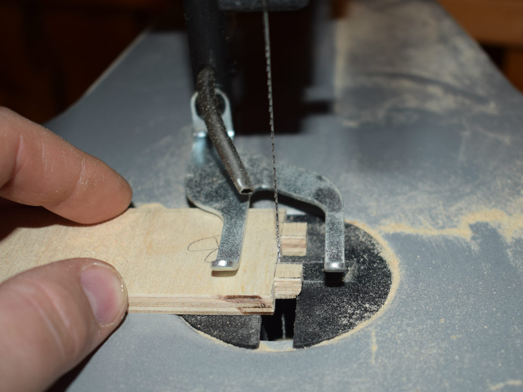 wood particles are cut out with jigsaw