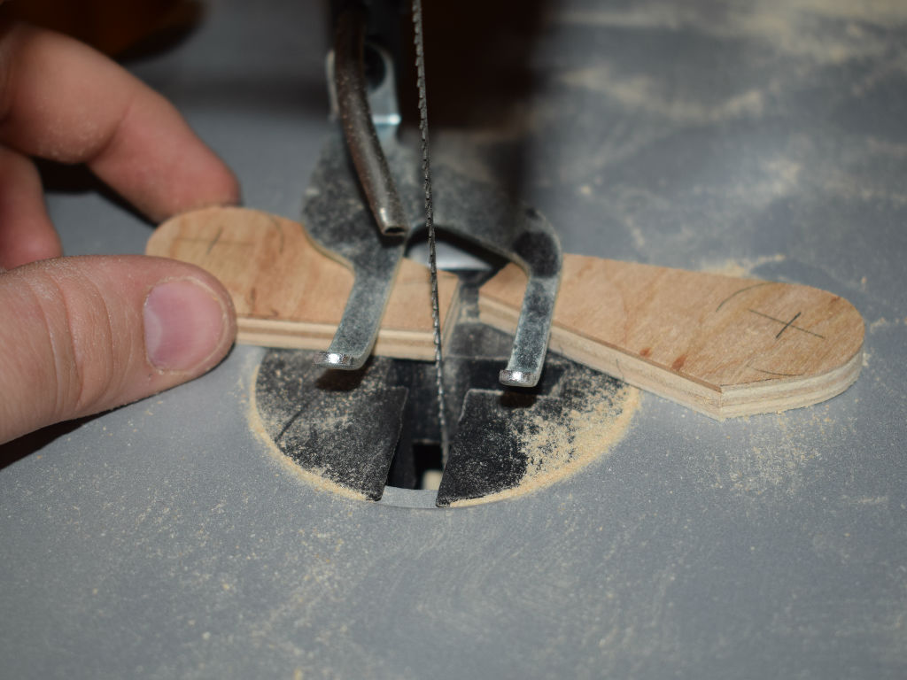 wood particles are cut out with jigsaw