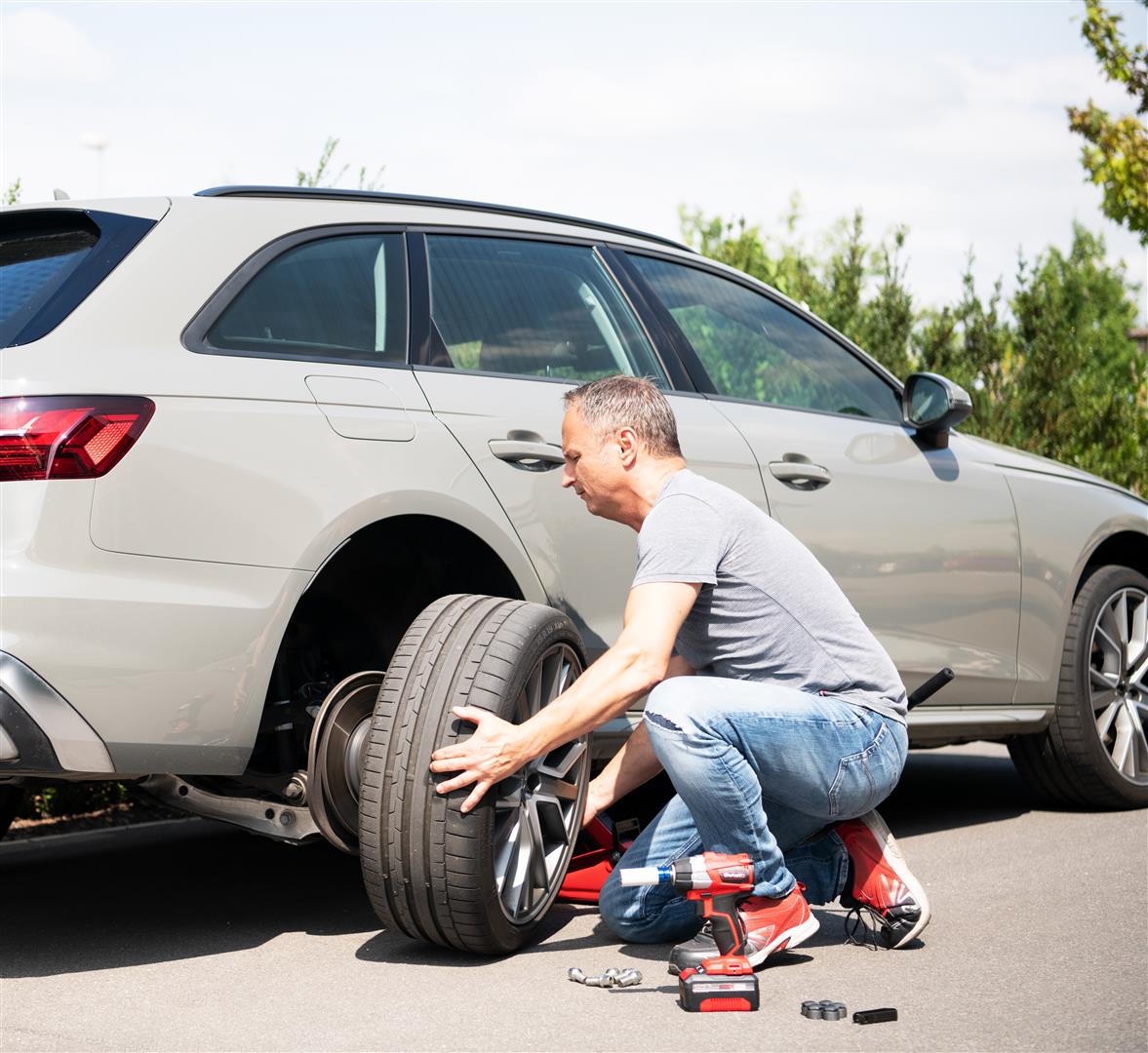 a man removes the tires from his car