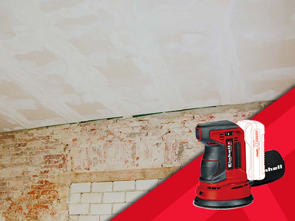 a wall and a ceiling with a rotating sander