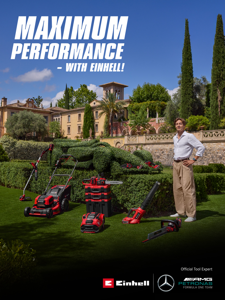 George Russell with Einhell tools in front of a race car hedge, text: “Maximum Performance – with Einhell!”