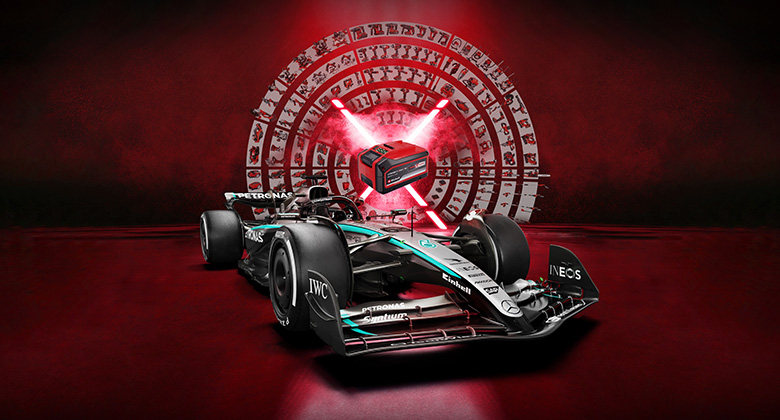 A Mercedes-AMG PETRONAS Formula 1 car is set against a vibrant red background featuring an Einhell battery at the center. The Einhell and Mercedes-AMG PETRONAS F1 Team logos are displayed in the bottom right corner.