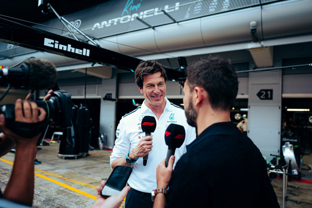 Toto Wolf getting interviewed from a reporter. 