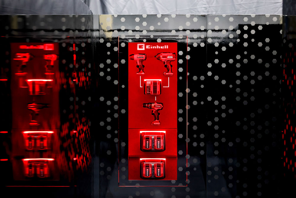Einhell tools on a wall.