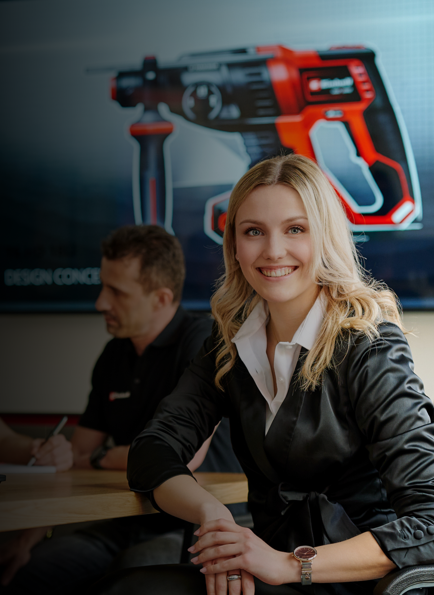 A woman smiling into the camera.