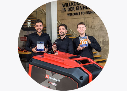 Three men holding the Top Company awards 2023 & 2024.