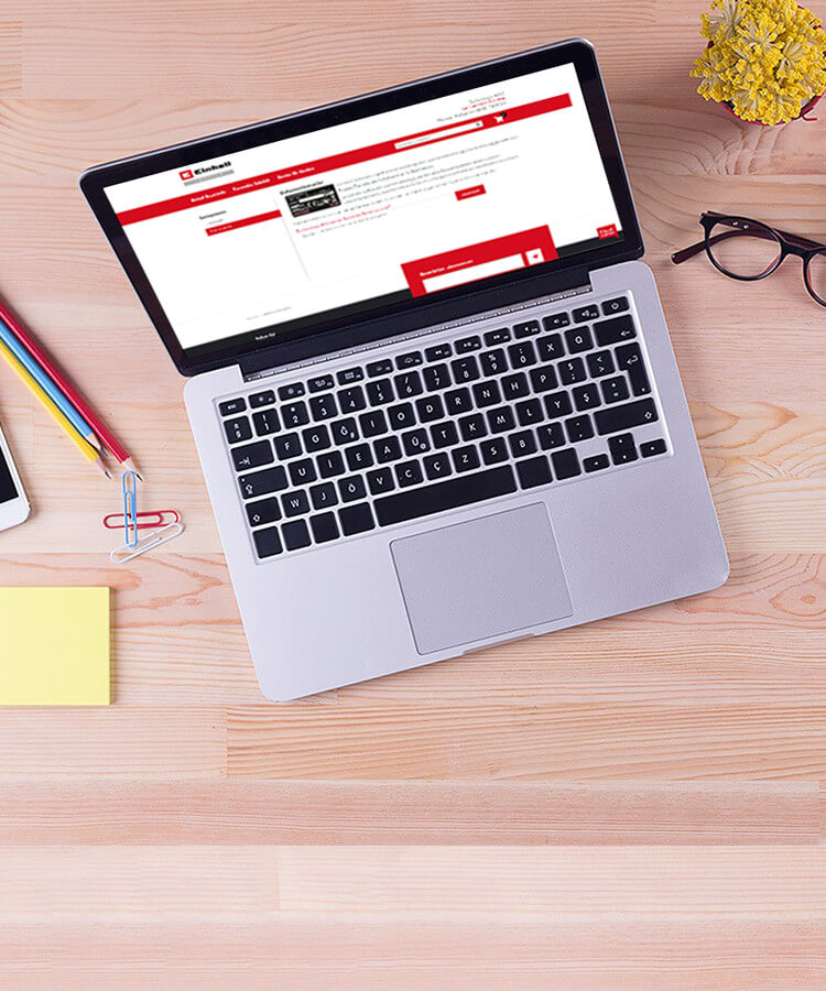 laptop on a table with einhell service shops