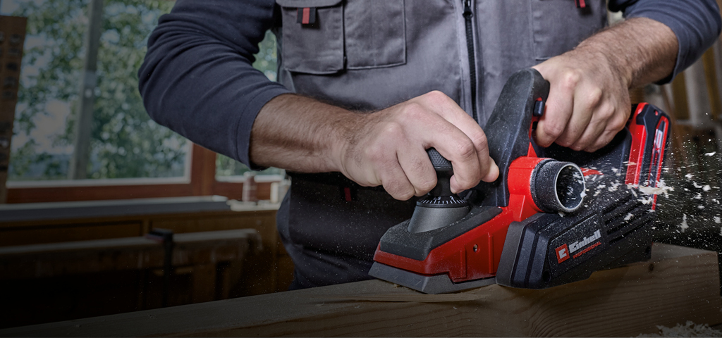 A man using a Power-X-Change sander