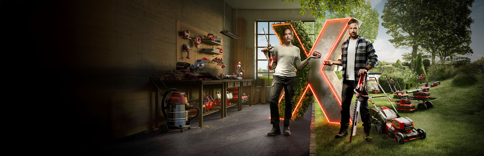 Two people stand in front of a large illuminated "X," surrounded by various cordless Einhell tools and garden equipment in a semi-open workshop and garden area.