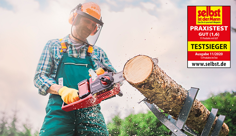 man working with a cordless chainsaw