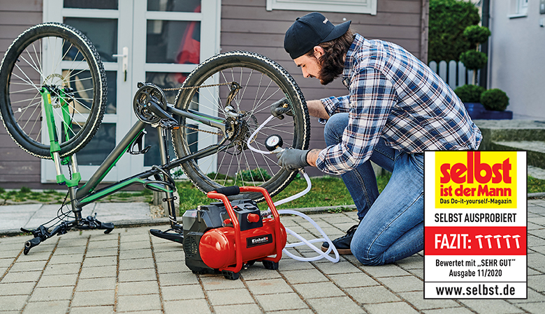 man using an air compressor